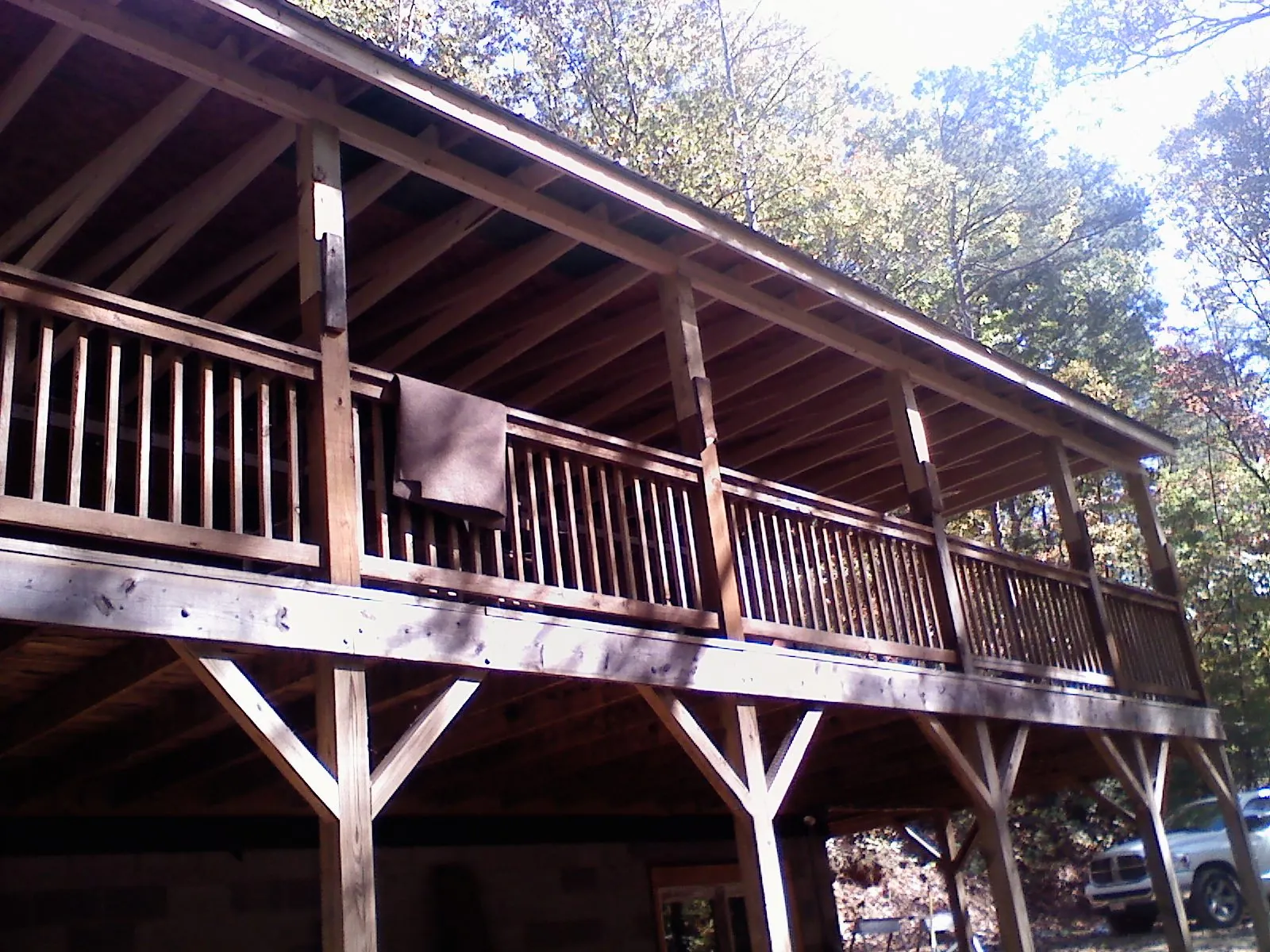 Timber framing under a new elevated porch and deck in Etoile
